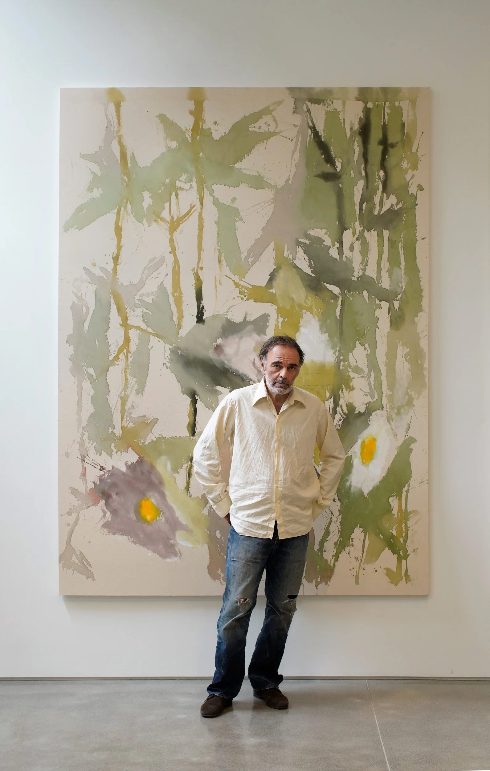 Vakho Bugadze (ვახო ბუღაძე, Vakhtang Bugadze) in front of his paintings from the Series of Flowers