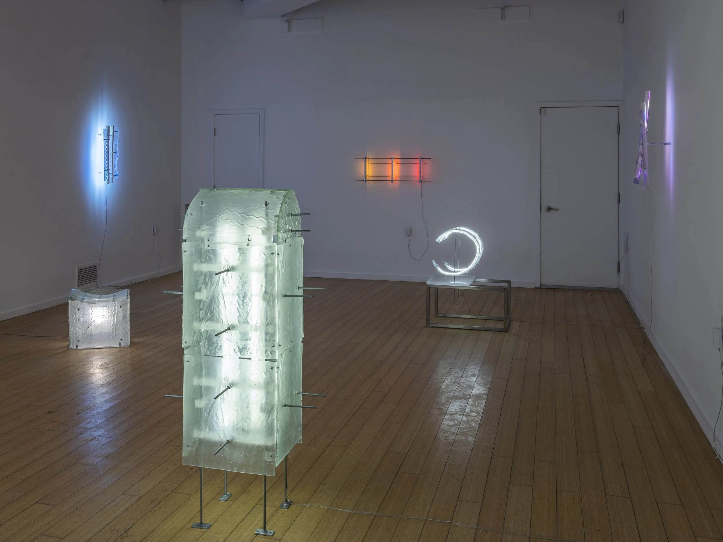 Art installation with illuminated glass sculptures and neon lights by artist Lizzie Wright in 2023 at the Catskill Art Space in Livingston Manor, NY.