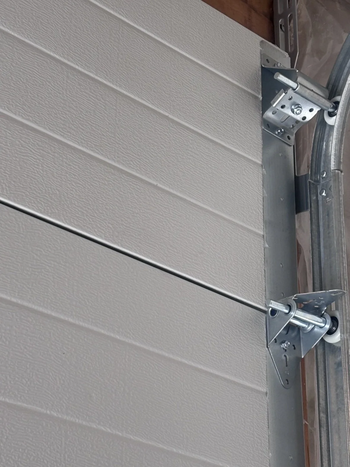 Hinges, rollers and track — the hardware we inspect on every tune-up