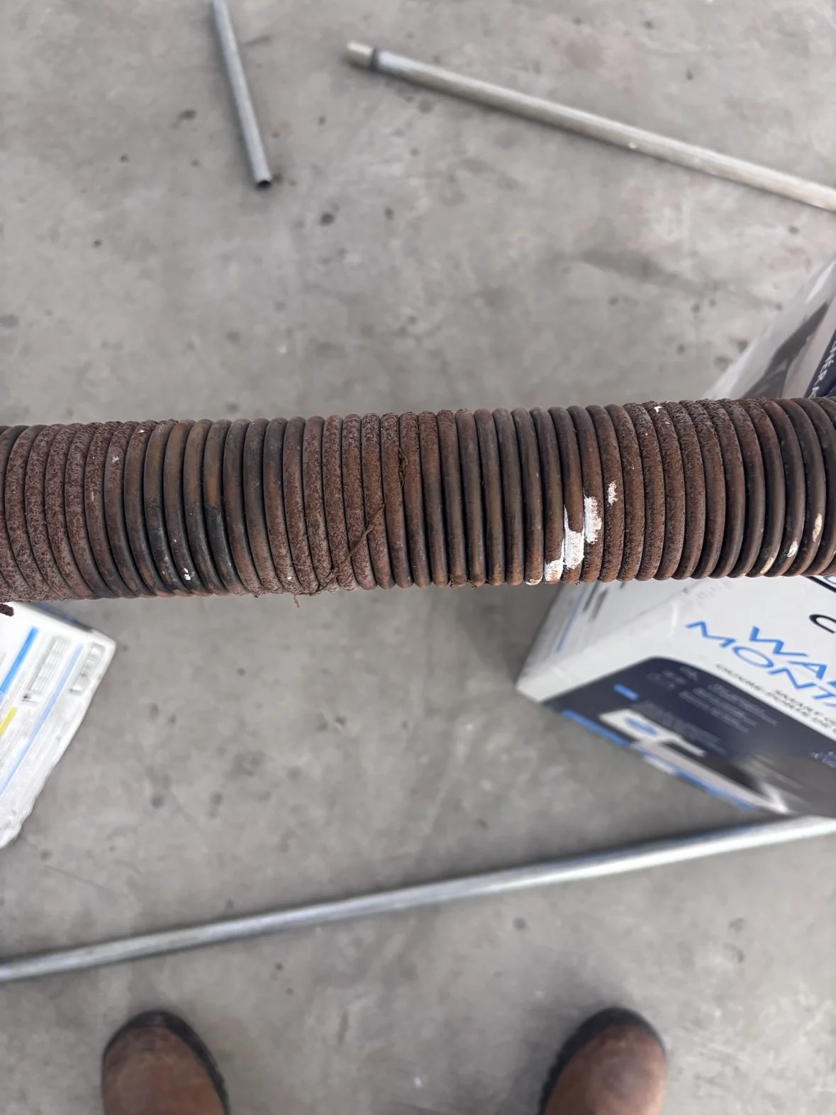 Worn, rusted torsion springs — replaced before they break