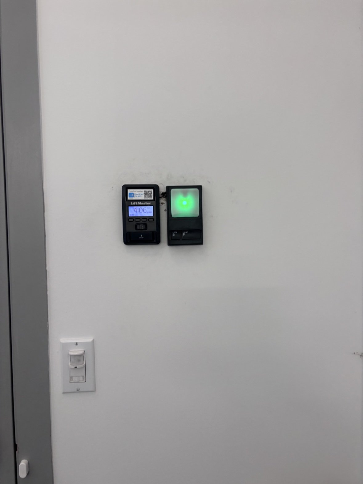 LiftMaster wall controls — keypad and motion-sensing light panel