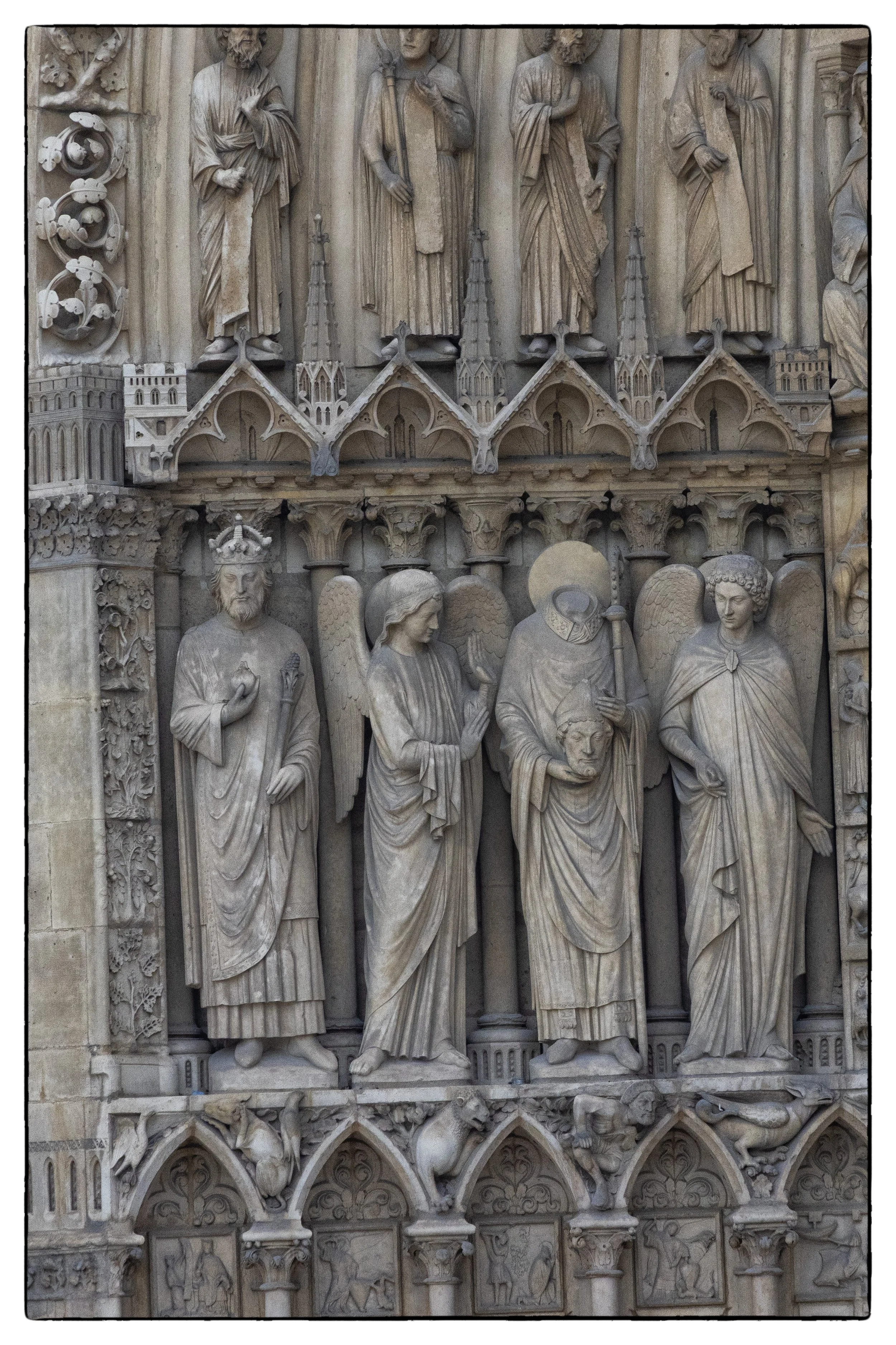 St Denis, head in  hand, Notre Dame Cathedral, Paris