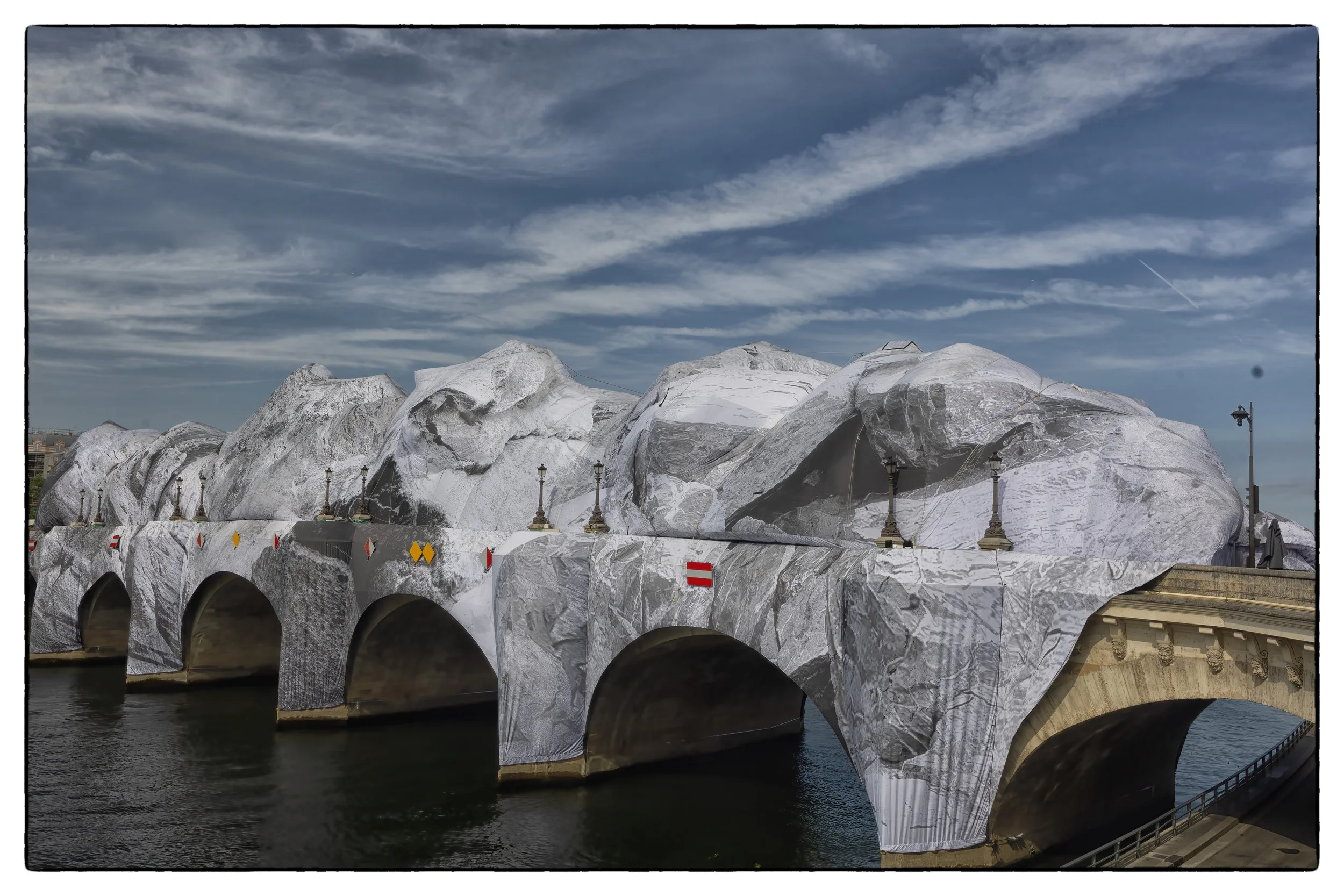 La Caverne - Wrapping of du Pont-Neuf June 2028 in commemoration of Christo and Jean-Claude who wrapped the bridge 40 yrs prior, Paris