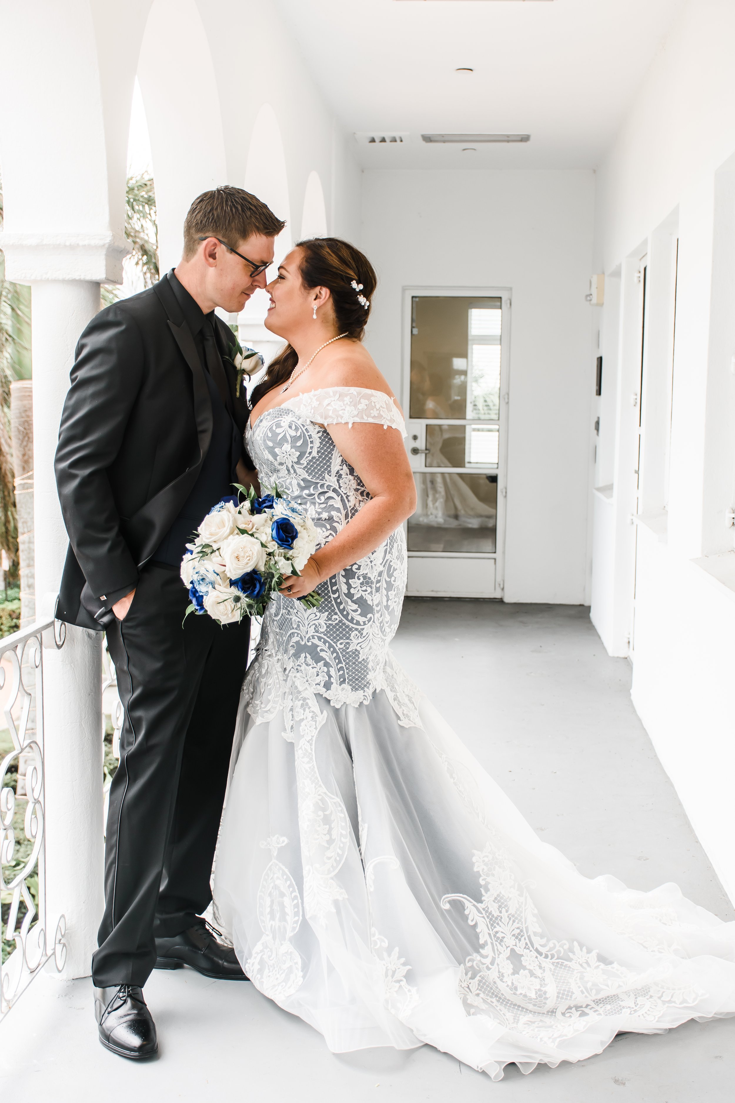 MAN AND WIFE SMILING AT EACH OTHER WITH NOSES TOUCHING