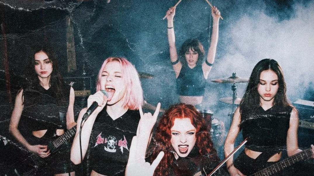 Pink Paradox all female metal band together live on stage.