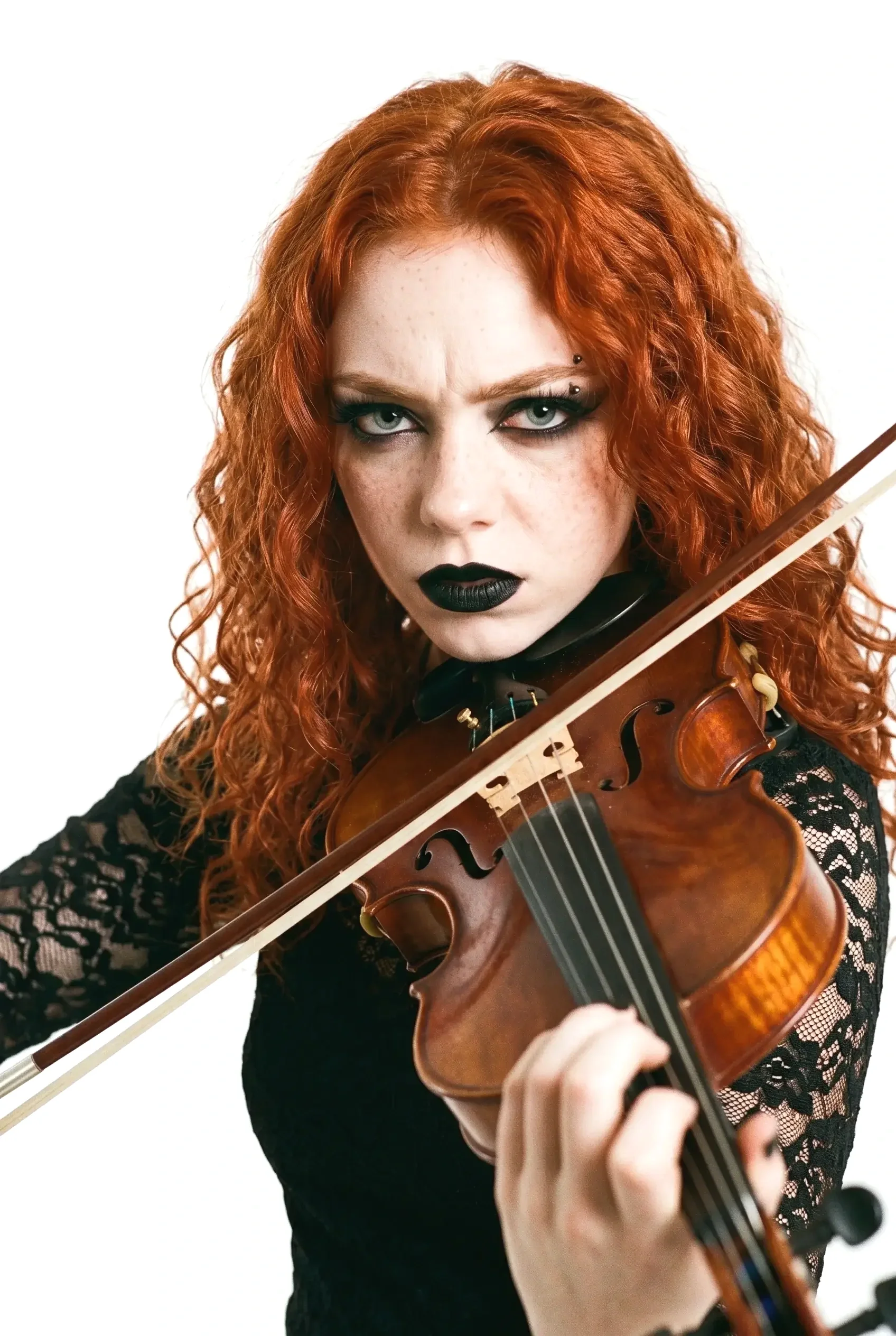 Clara Meier, violinist of the female progressive metal band Pink Paradox, with her long curly red hair and dark makeup playing her violin, wearing a 
black top.