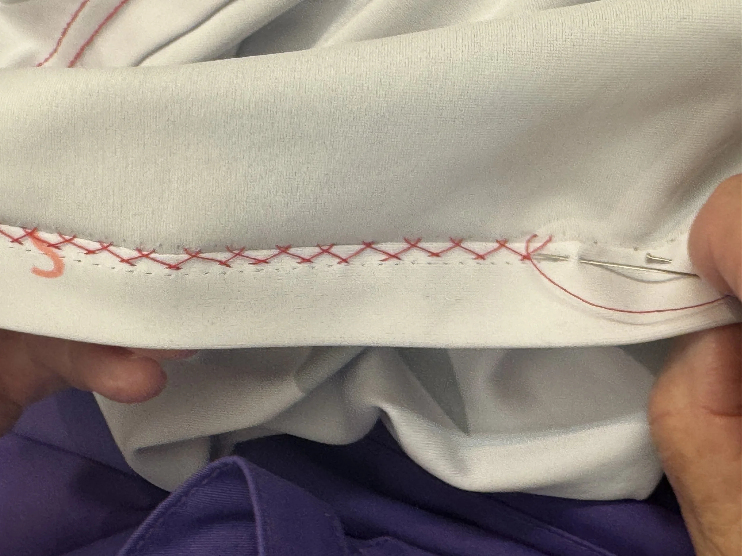 Wendy demonstrates how to beautifully stitch a hem of stretch fabric….