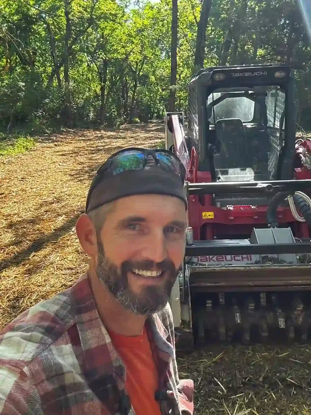 Hap, owner of Solid Ground, with Takeuchi TL12R2 forestry mulcher in Grain Valley, MO