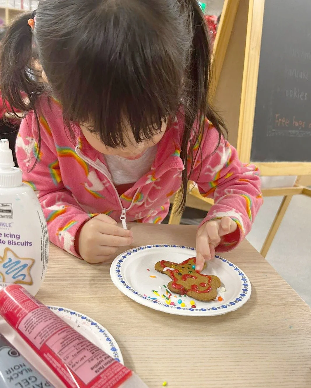 Our OSC students baked gingerbread cookies as part of our holiday activities! Measuring and mixing supported early math skills, fine motor development, and collaboration, plus it made the classroom smell amazing!