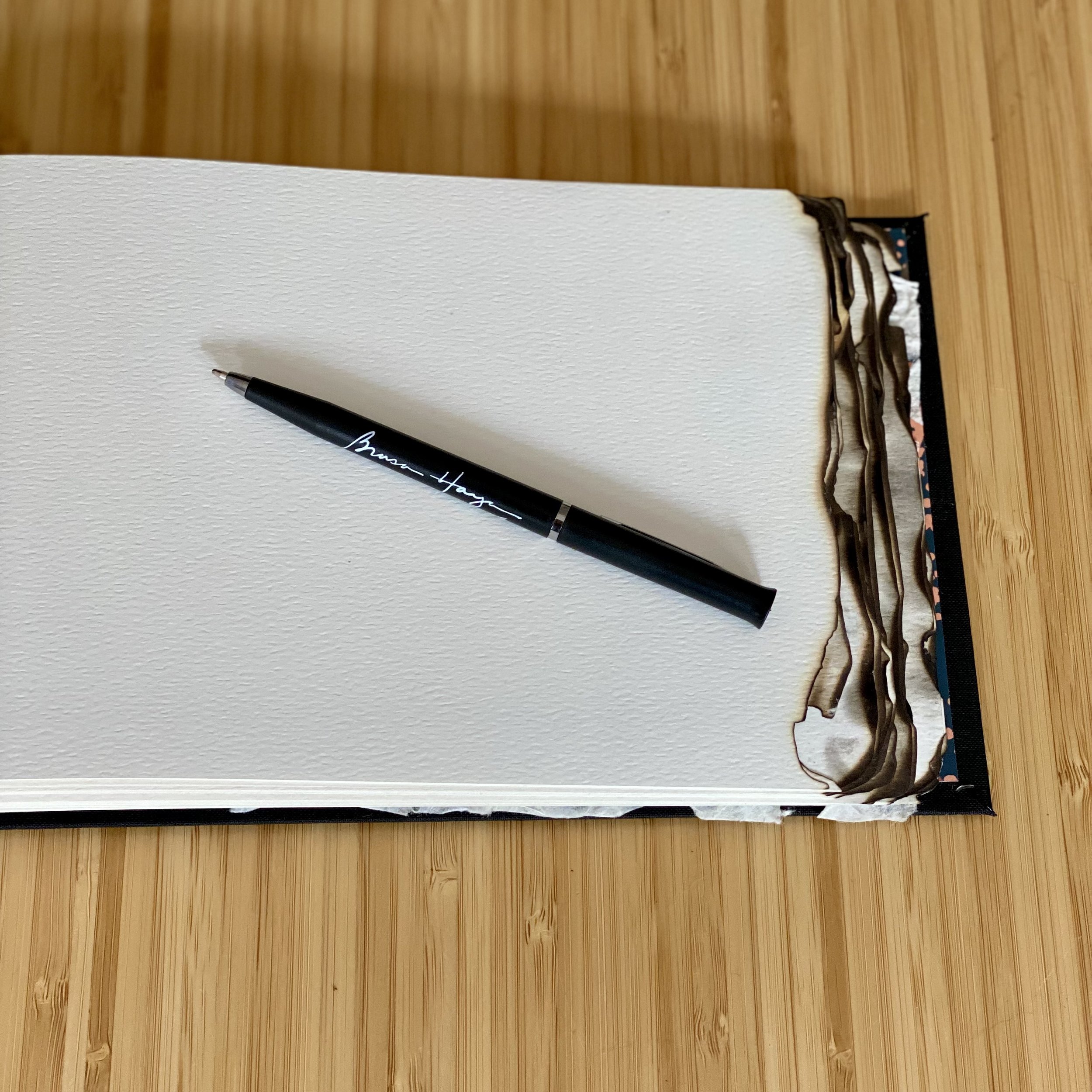 Guestbook for Brasa Haya, a resturant serving Spanish cuisine in Portland, OR, was one of my favorites to create. The inside cover displays a sample of the wallpaper. Burnt paper edges give a nod to the restaurant's name which translates to “beech em