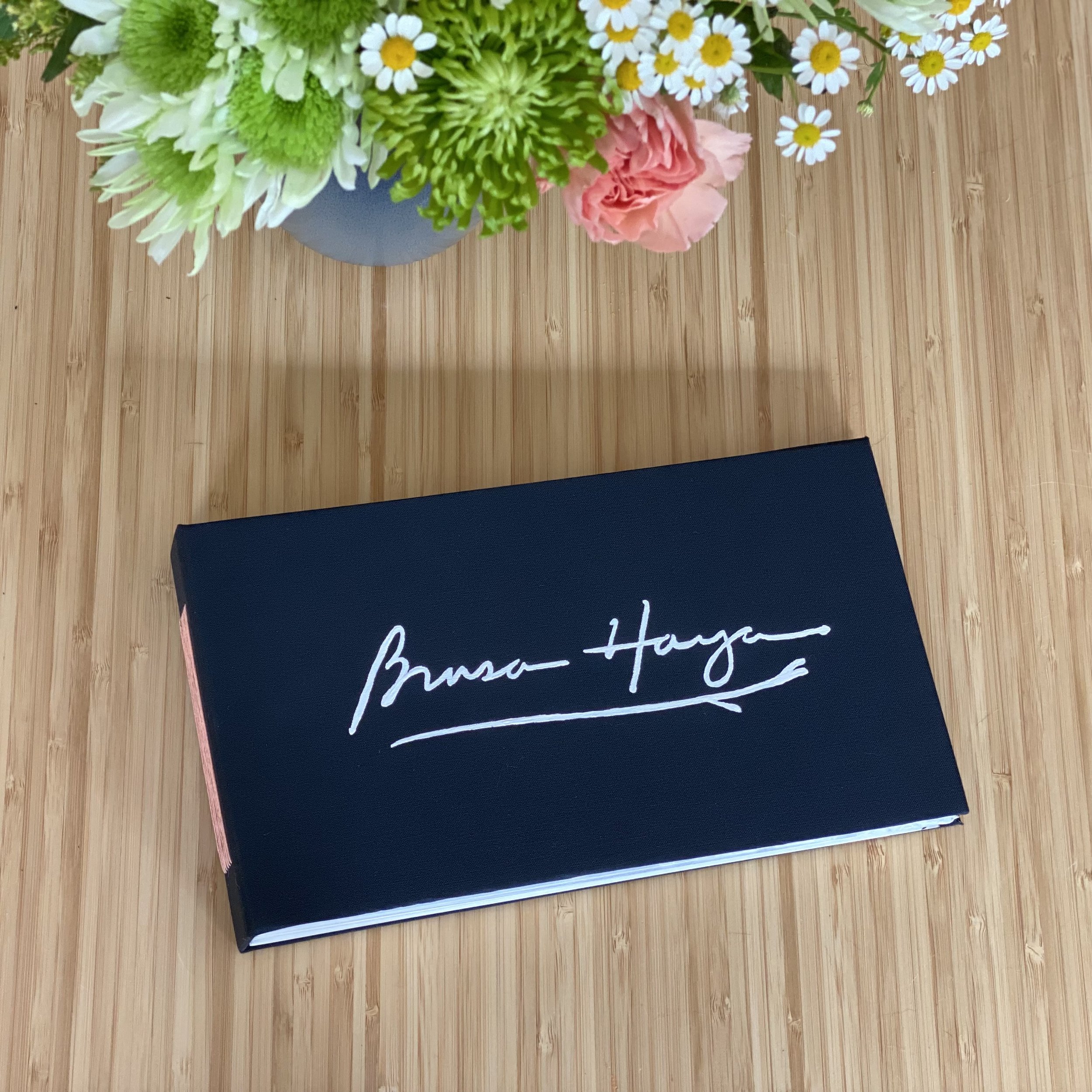 Guestbook for Brasa Haya, a resturant serving Spanish cuisine in Portland, OR, was one of my favorites to create. The inside cover displays a sample of the wallpaper. Burnt paper edges give a nod to the restaurant's name which translates to “beech em