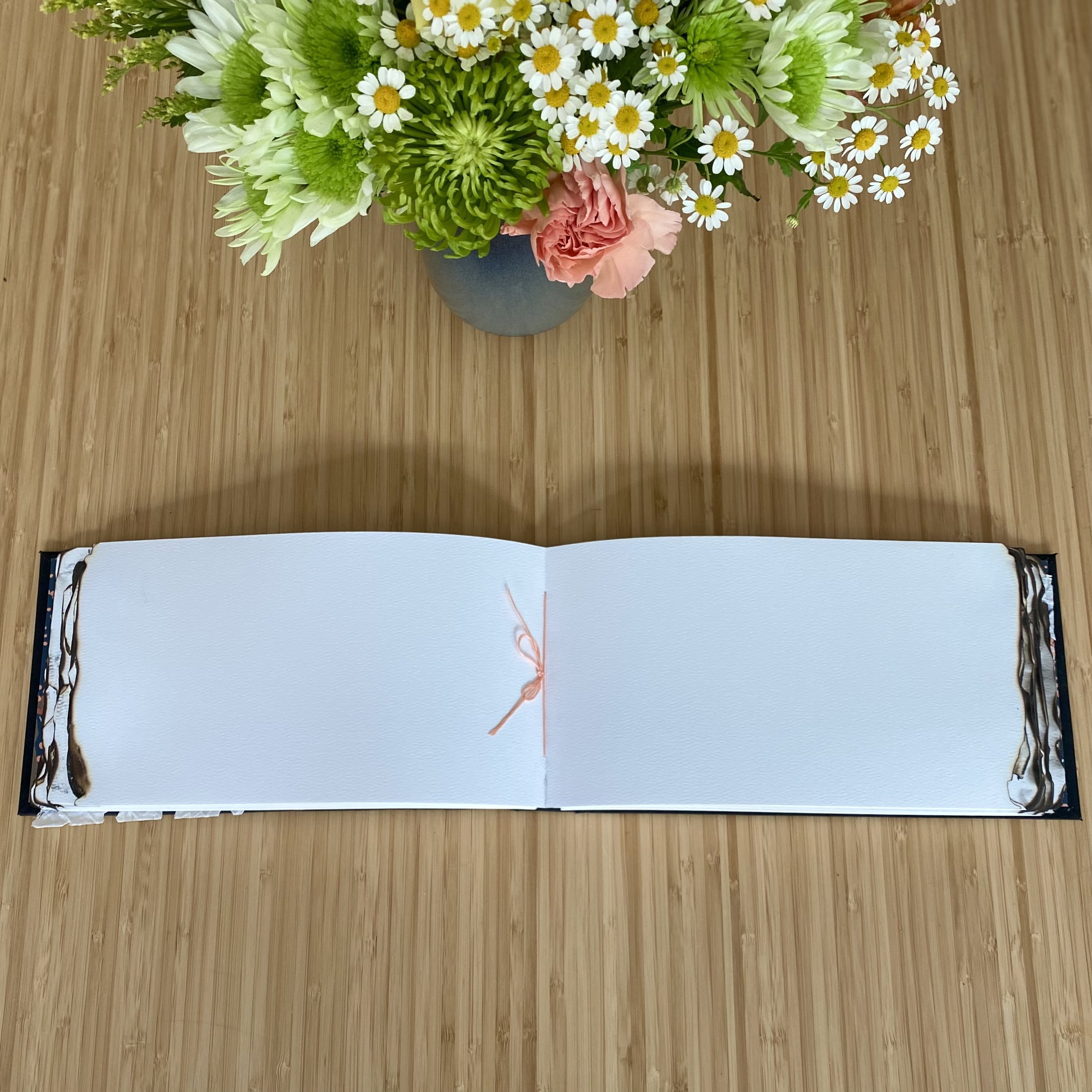 Guestbook for Brasa Haya, a resturant serving Spanish cuisine in Portland, OR, was one of my favorites to create. The inside cover displays a sample of the wallpaper. Burnt paper edges give a nod to the restaurant's name which translates to “beech em