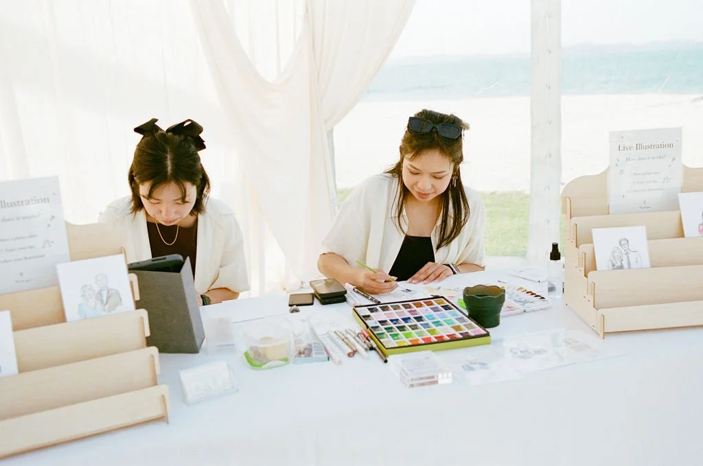 Esther and assistant creating live illustrations