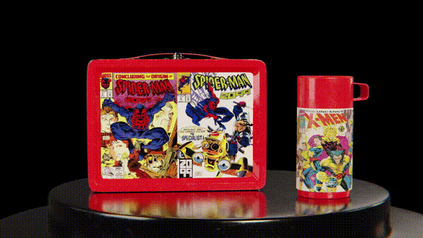Vintage Spider-Man lunch box with Thermos featuring comic book designs on a rotating platform.