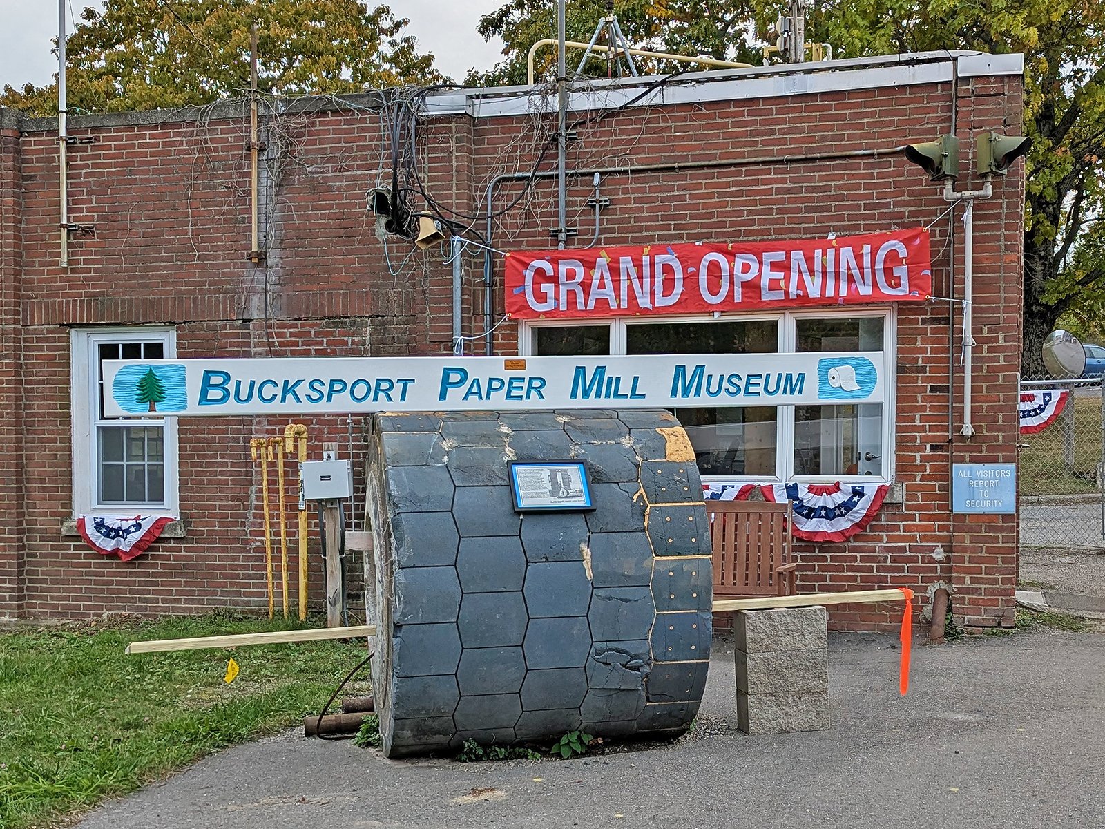 The Bucksport Paper Mill Museum logo on top of an image of the building that will house the museum.