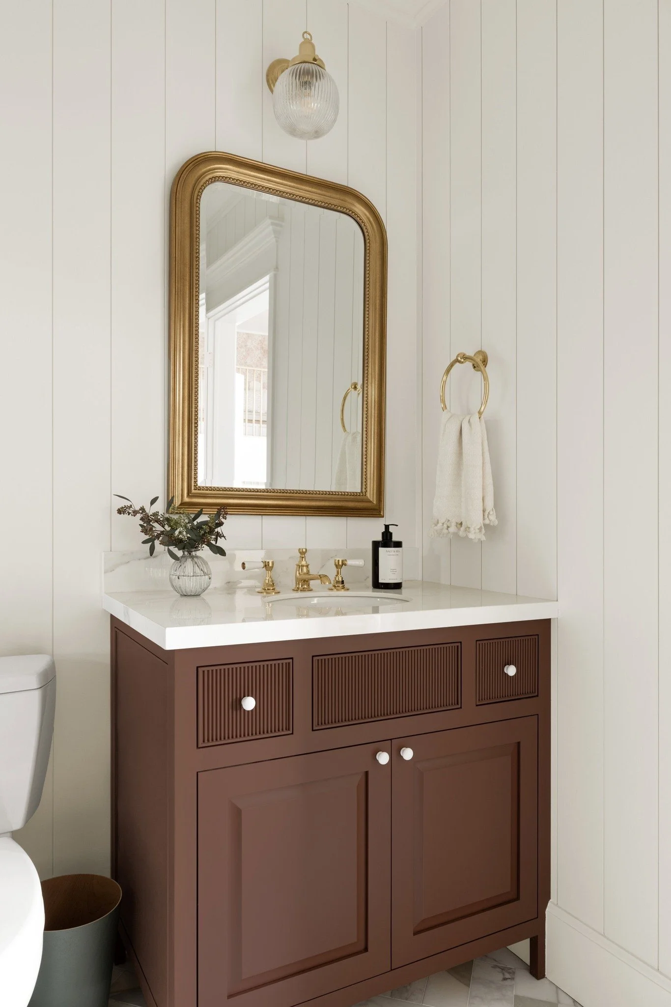 It starts with dark wood against soft board-and-batten walls. Clean lines, natural grain, and stone that adds quiet elegance. Every layer builds a bathroom that feels warm, timeless, and lived in. 

✨ Ready to bring craftsmanship into your own home? 