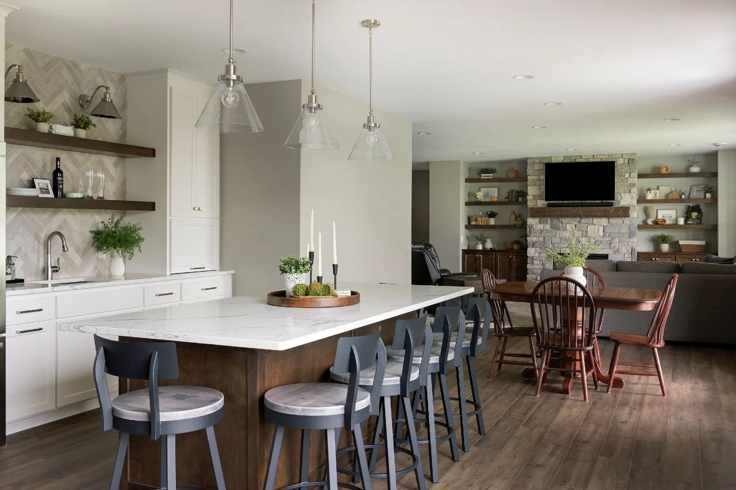 A basement that doesn&rsquo;t act like one. Deep drawers, hidden storage runs, and a quartz island built to handle every game night, movie marathon, and midnight snack. This cabinetry works hard, looks better, and refuses to feel &ldquo;lower level.&