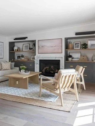 These living room built ins work because they balance display and storage without competing with the space. Painted cabinetry grounds the room, open shelving keeps it light, and consistent proportions make everything feel intentional. This is how mil