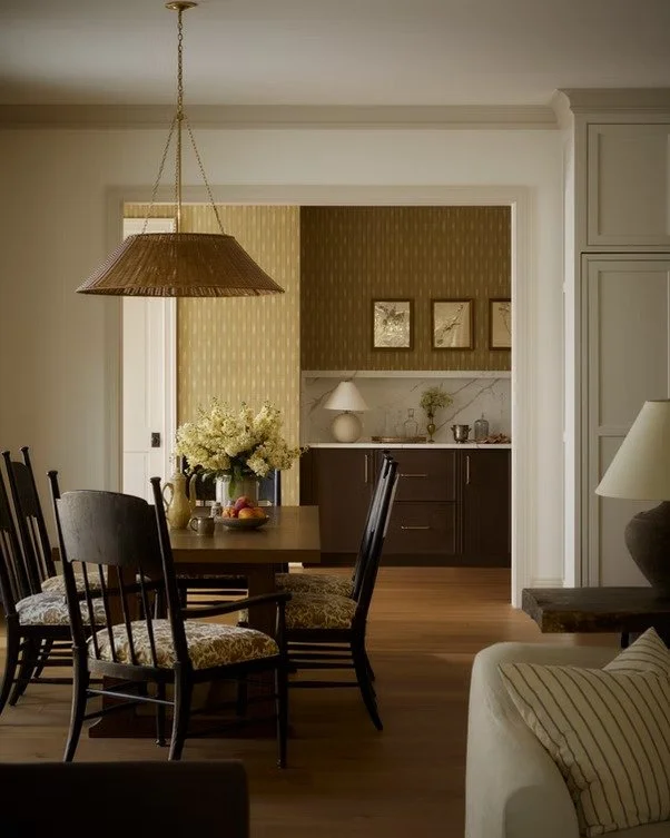 The tones in this room are just&hellip; sexy. Deep, rich wood. Warm brass. Soft, layered neutrals. Nothing is loud, but everything feels intentional.

And the cabinetry is what grounds all of it. It gives the space weight, structure, and a place for 
