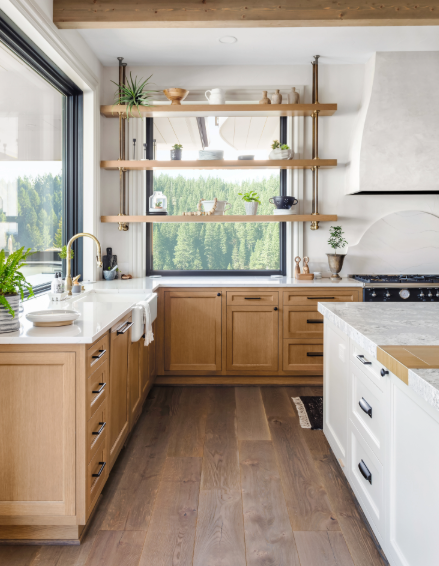 Kitchen design featuring warm wood base cabinets, painted cabinetry, and open wood shelving, demonstrating a balanced mixed-finish cabinetry approach with natural materials.