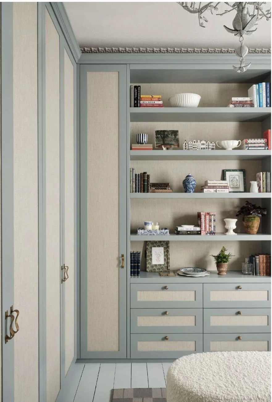 Integrated built-in cabinetry with open shelving and concealed storage designed to blend into the home architecture