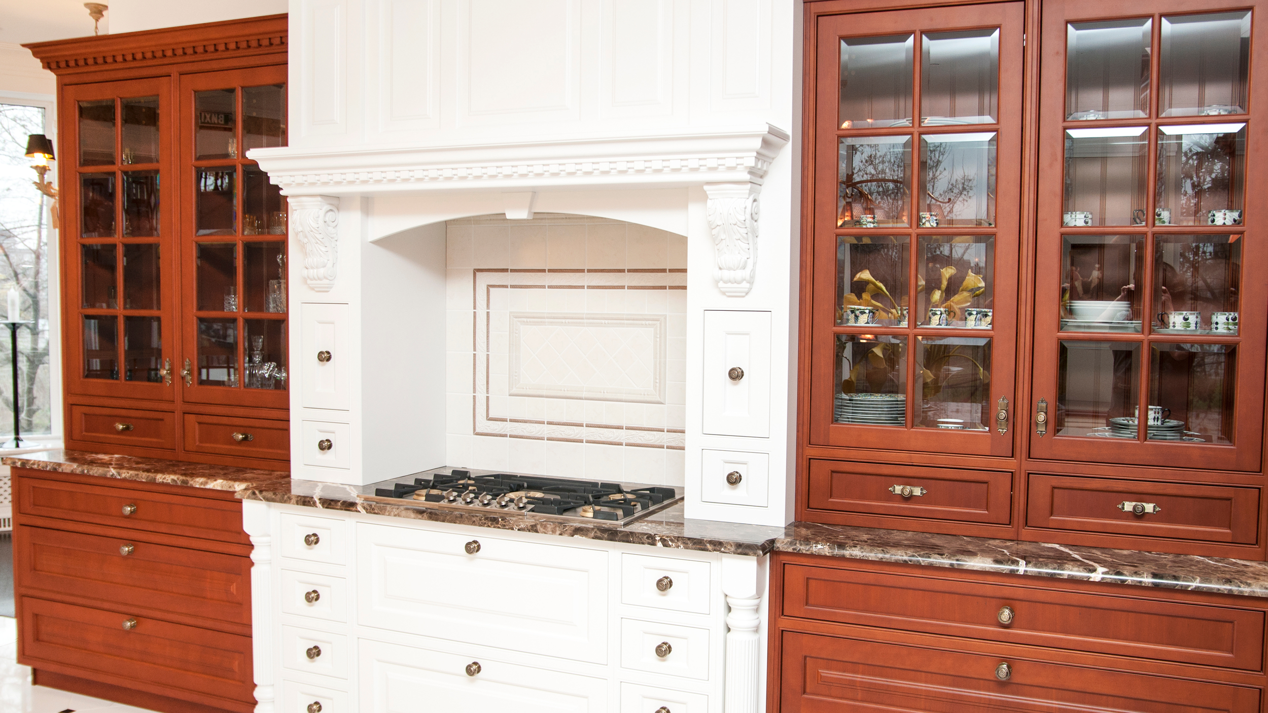 Two-tone raised panel cabinetry kitchen
