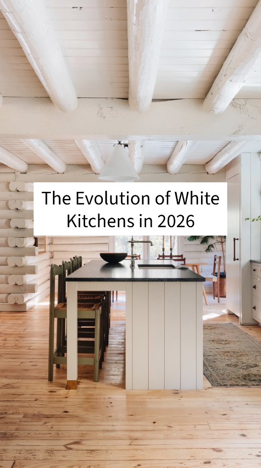 The evolution of white kitchens in 2026 featuring soft neutral cabinetry, wood accents, and layered kitchen design trends