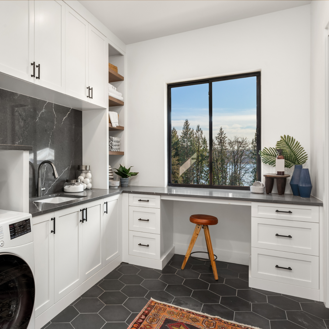 Laundry room cabinetry with built-in desk and storage in Gainesville GA by Hester Family Millwork
