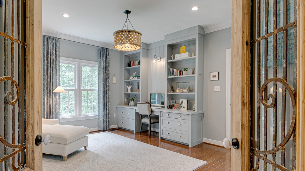 Custom built-in home office desk with bookshelves by Hester Family Millwork
