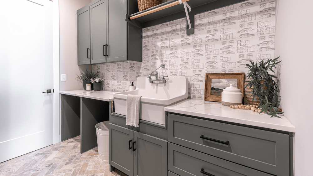 Mudroom cabinetry with utility sink and storage by Hester Family Millwork