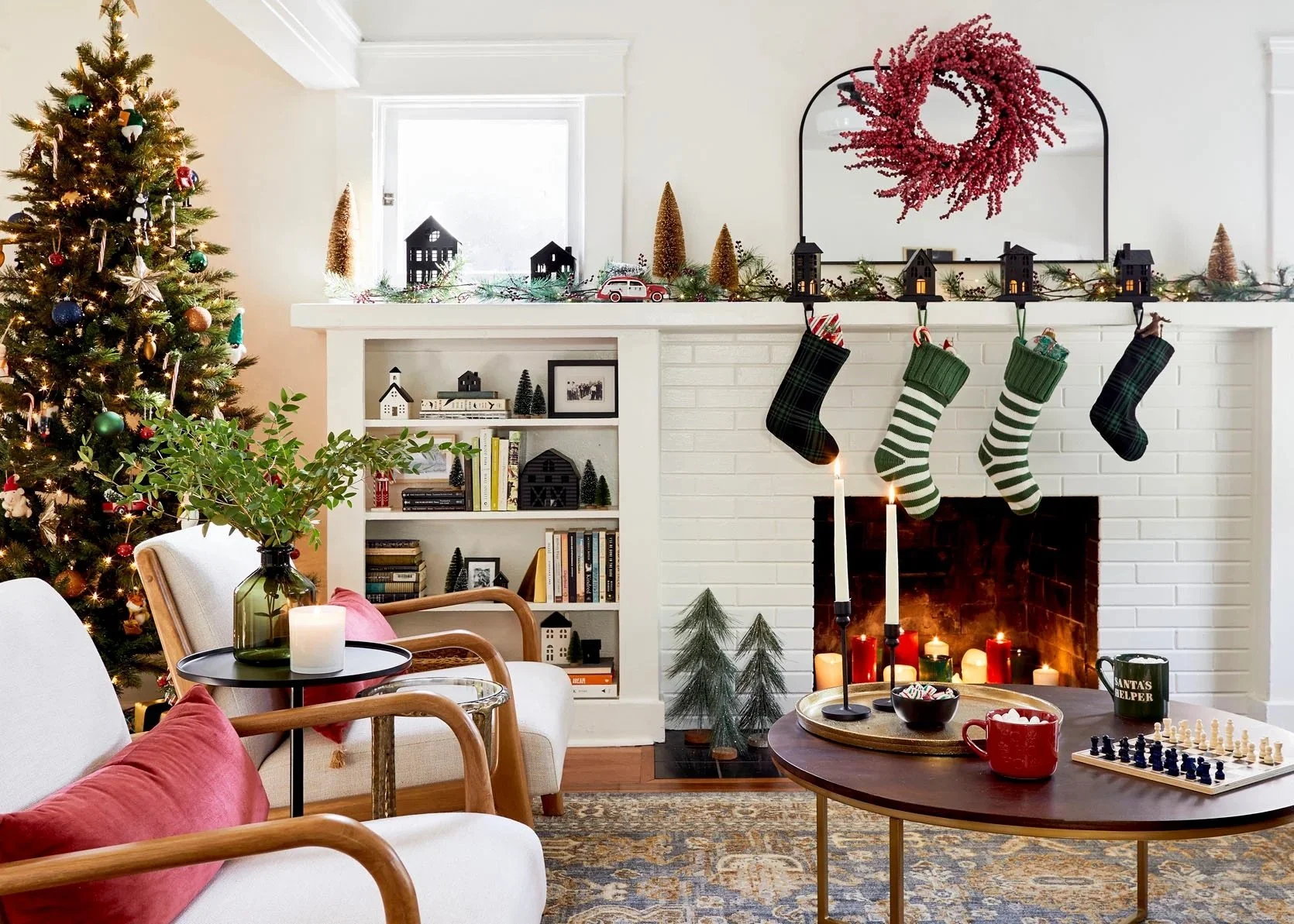 Custom living room built-in shelving and fireplace surround decorated for Christmas, showcasing classic cabinetry, functional storage, and timeless millwork in a warm, lived-in home.
