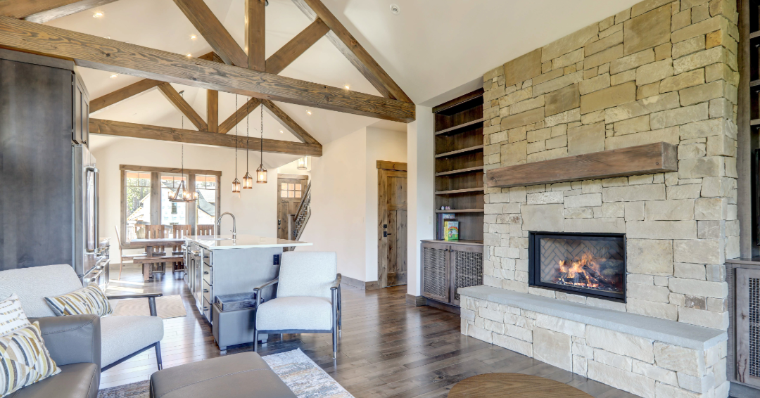 Custom built-in cabinetry and shelving around a stone fireplace in North Georgia