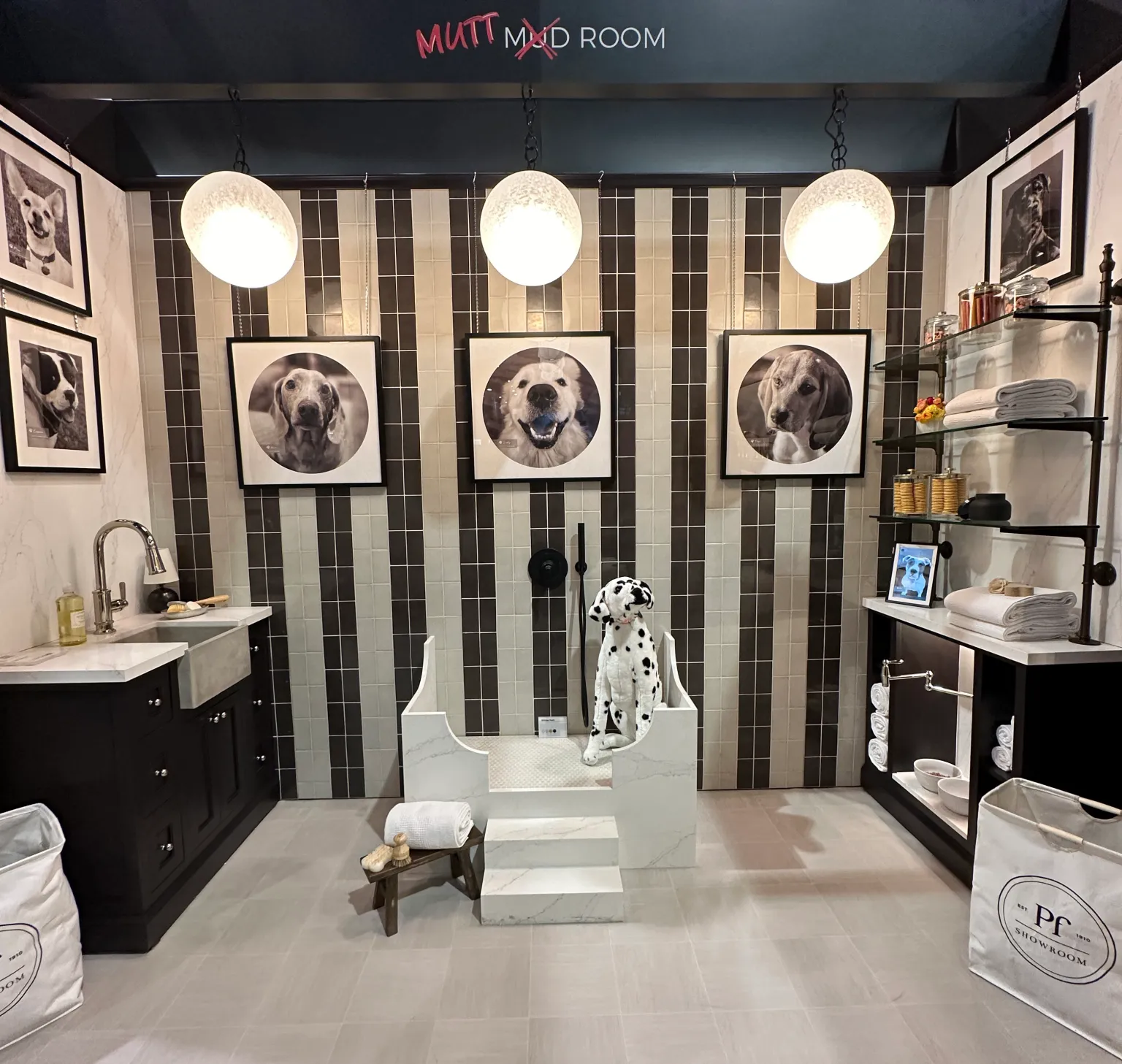 Luxury pet wash station with custom cabinetry, tile wall, and built-in dog shower in a mutt mud room by Hester Family Millwork.