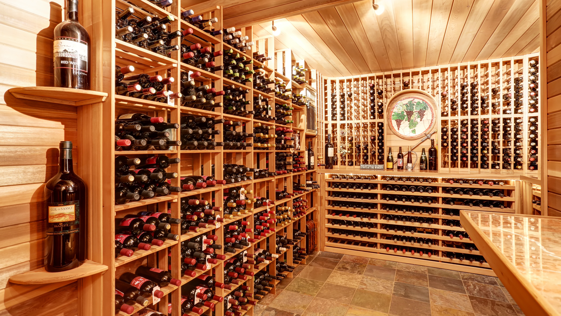 Custom wine cellar with all-wood cabinetry and built-in wine racks, designed by Hester Family Millwork for luxury home storage.