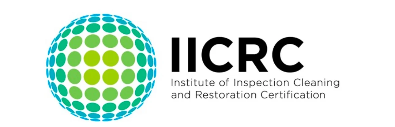 Logo of the Institute of Inspection Cleaning and Restoration Certification (IICRC), featuring a stylized globe with green and blue dots and the organization's name.