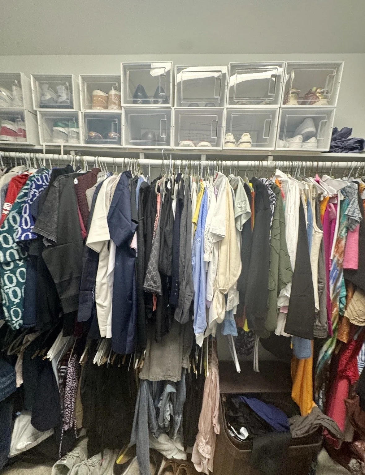 Shared closet organizing project in Sugar Land by Crystal Aura Organizing with defined spaces for both partners.