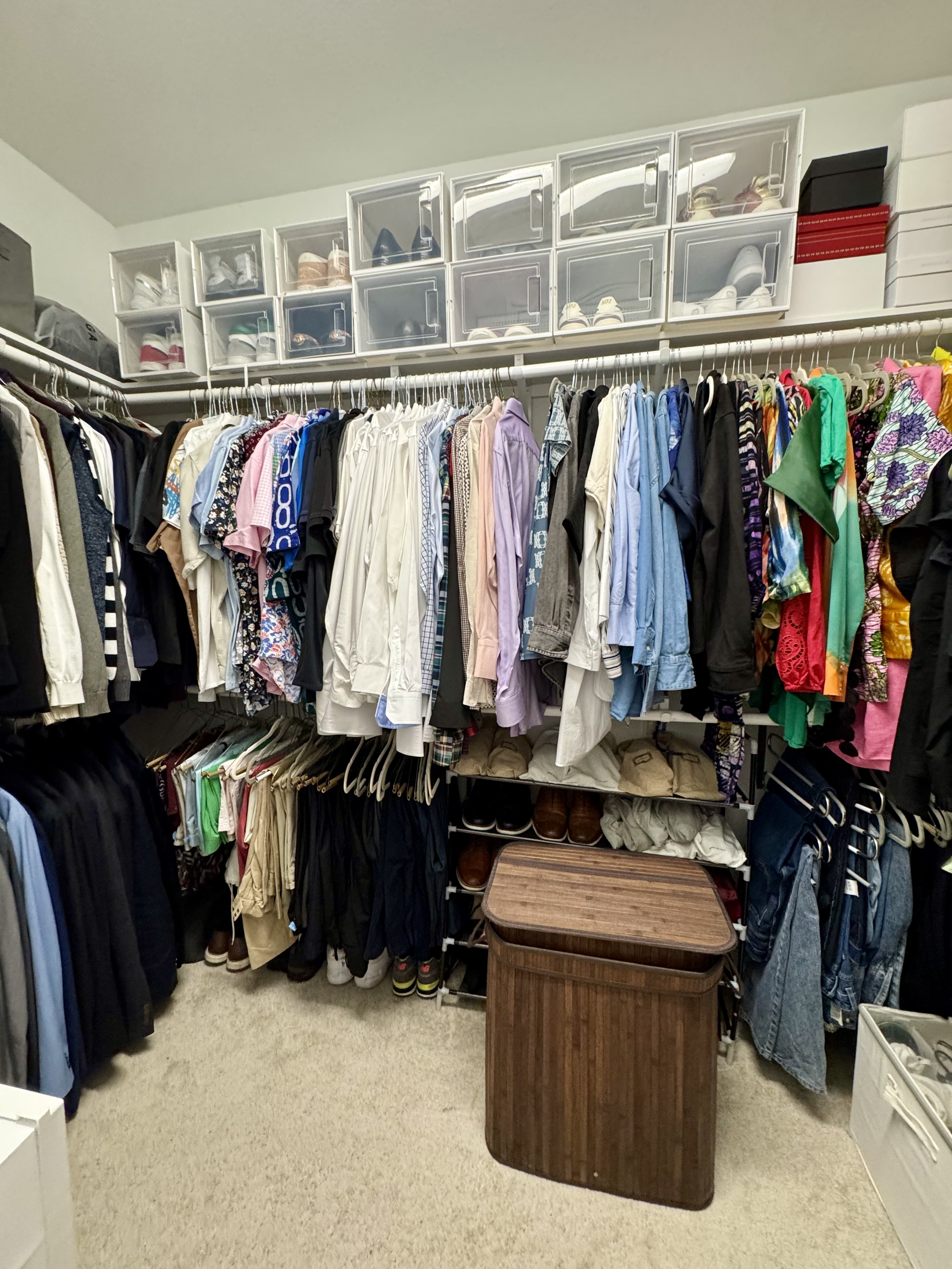 Organized shared closet in Sugar Land showing clear separation of men’s and women’s clothing by Crystal Aura Organizing