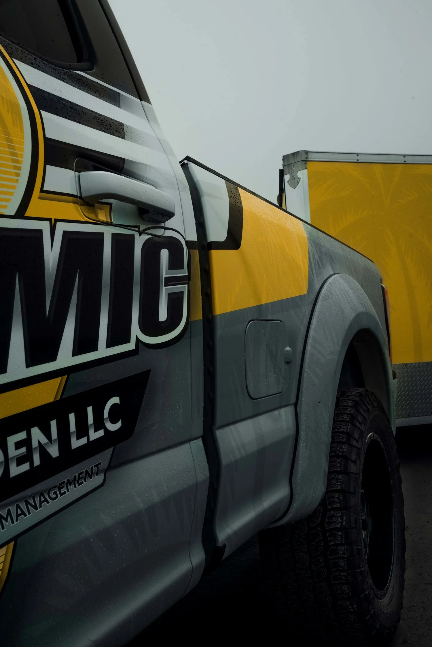 Close-up of a finished yellow and grey commercial vehicle graphic from SignApply’s design portfolio