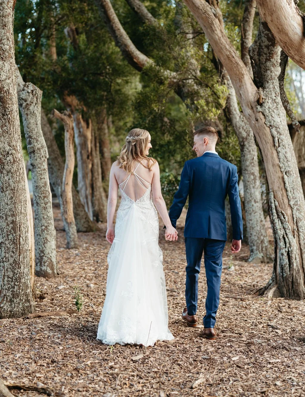 Laurie’s customers, Fernando and Kate embracing by the lake on their wedding day.