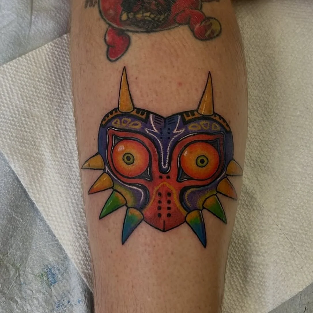 Where the Zelda fans at? 🙋&zwj;♂️🙋🙋&zwj;♀️ Check out this beautiful &amp; bright Majora&rsquo;s Mask by our resident artist @oski_ink 🙌 Oscar enjoys tattooing full color or black and grey pieces &amp; has time this month to tattoo YOU! 🫵 Reach o