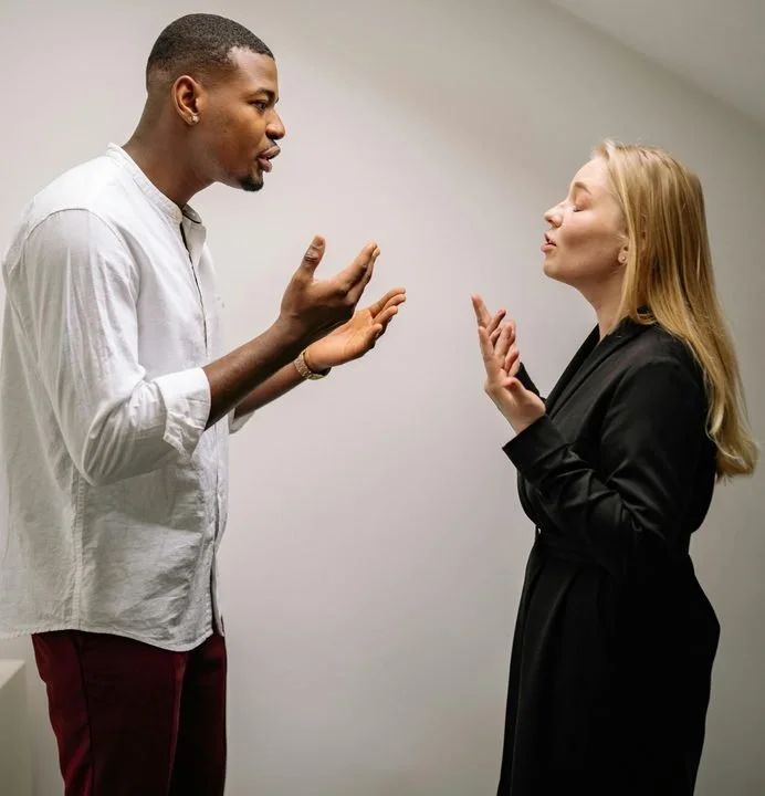 Couple engaged in an intense discussion, representing repeated relationship conflict and communication challenges addressed in couples therapy in San Francisco.