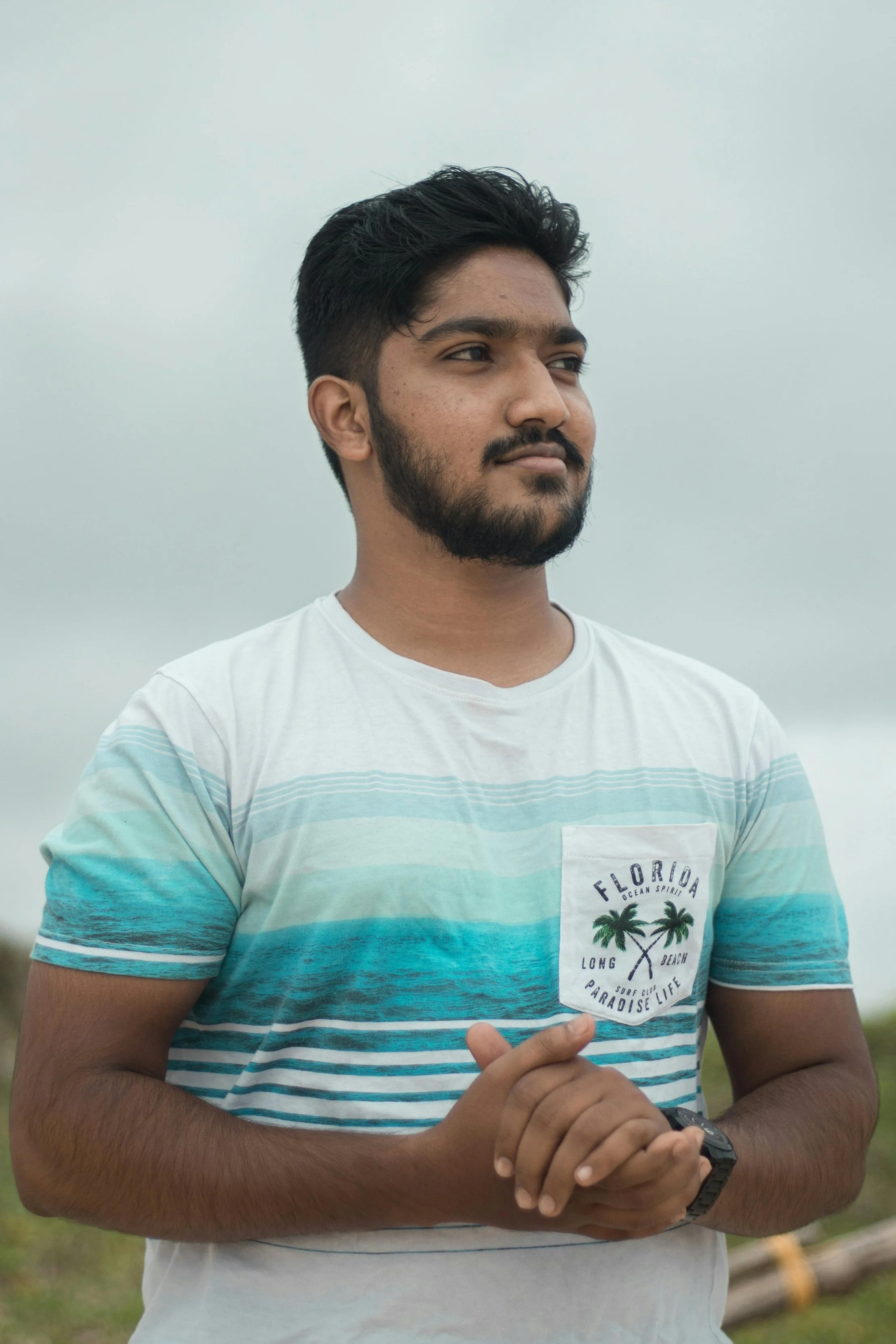 A person standing outdoors with a calm, thoughtful expression, symbolizing the quiet confidence and intentional connection style of introverts.