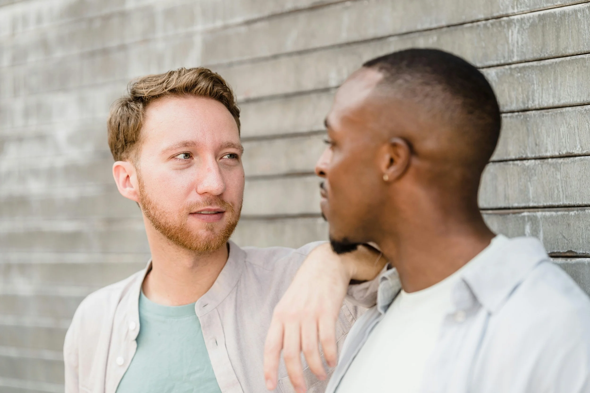 Two partners sharing a serious, vulnerable moment, symbolizing the work of rebuilding trust and healing after betrayal.