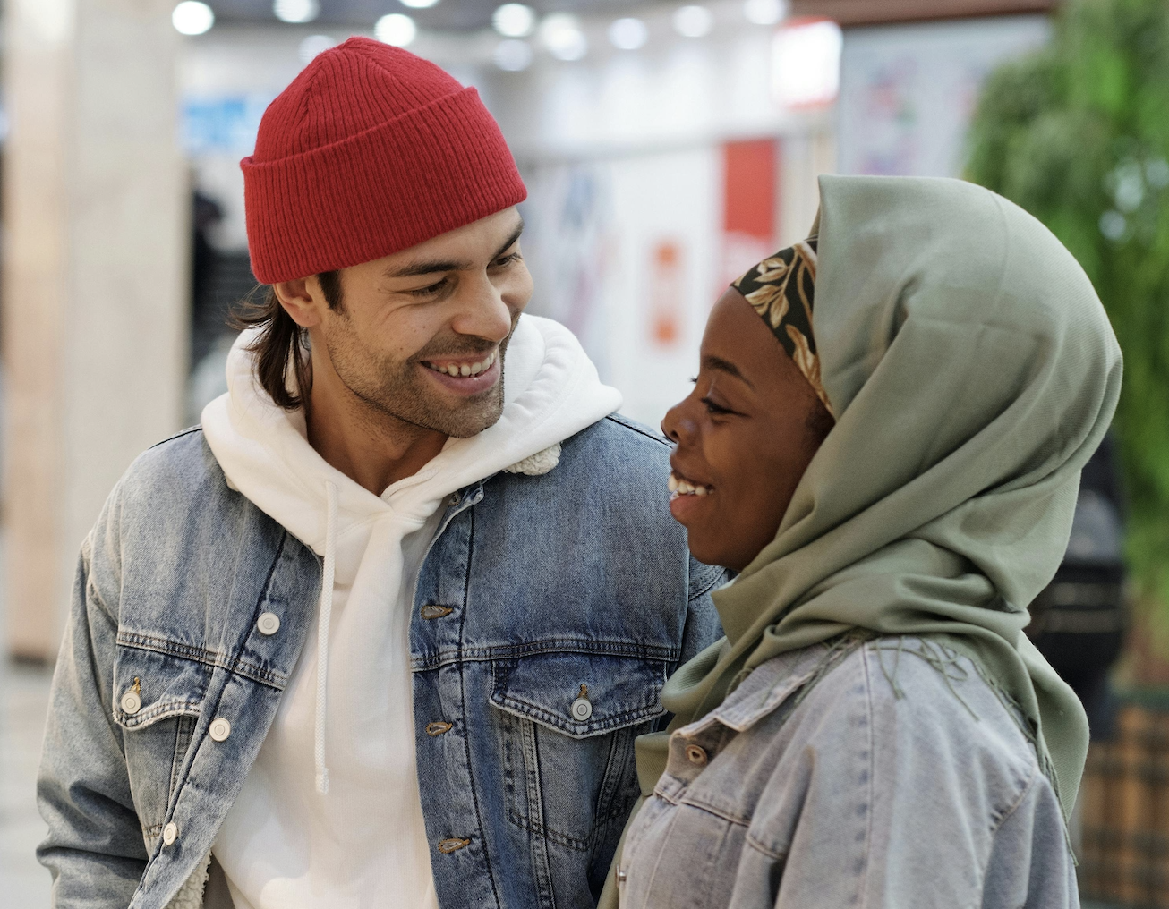 Two people smiling warmly at each other, symbolizing intentional dating and the process of choosing a compatible partner.