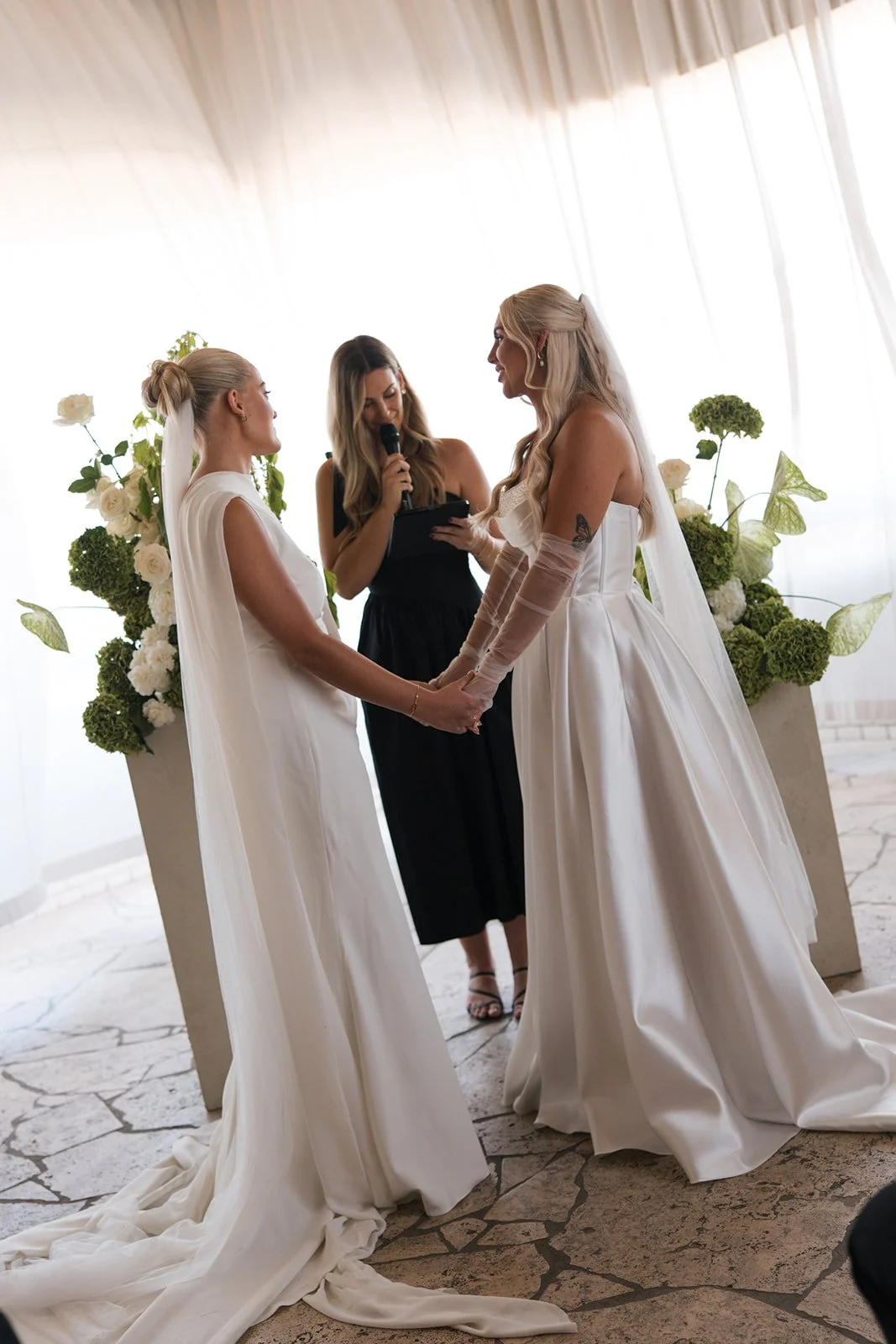 Two brides and wedding celebrant Love By Britt