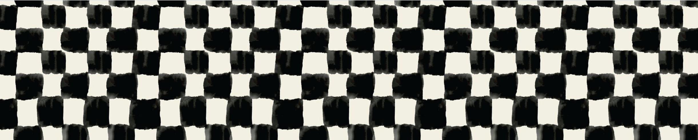 Close-up of a black and white checkered pattern, with the pattern resembling a fabric or textile design.