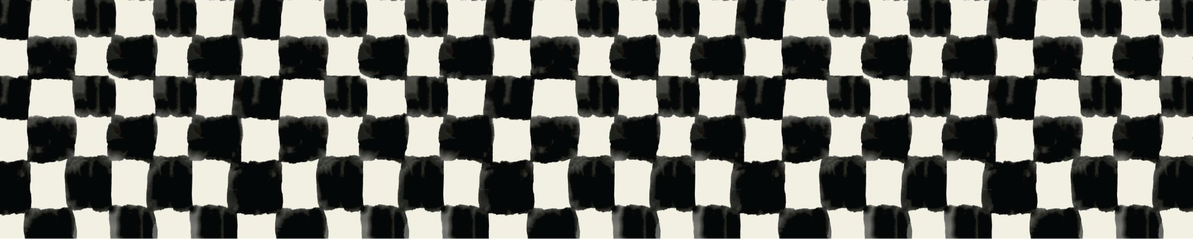 Close-up of a black-and-white checkered pattern, possibly made of fabric or printed material.