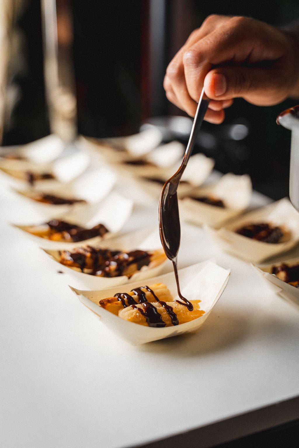 Did you know that event-friendly churros existed?!

Drizzled with warm chocolate sauce and served in handy boats, these sweet bites are made for mingling. No forks, no fuss. Simply deliciousness you can enjoy while you walk, talk, and work the room.
