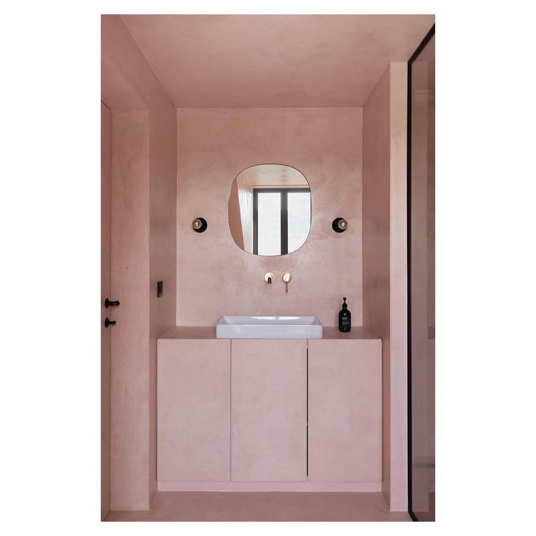 x-bond microcement bathroom with pink custom vanity