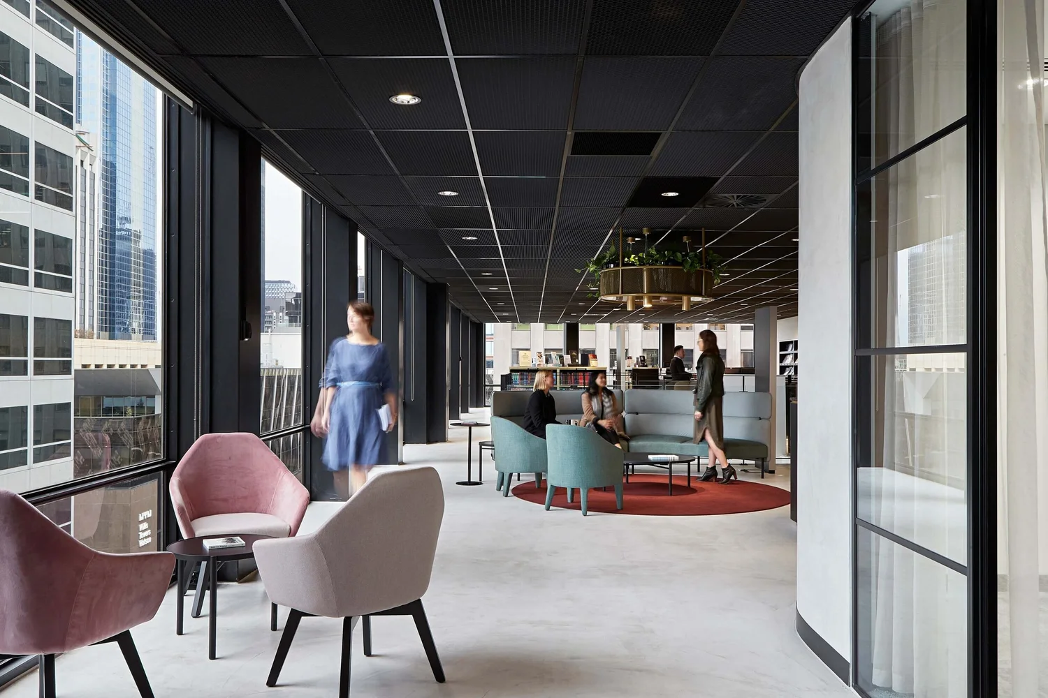 Commercial office lounge with seamless X-Bond Microcement flooring